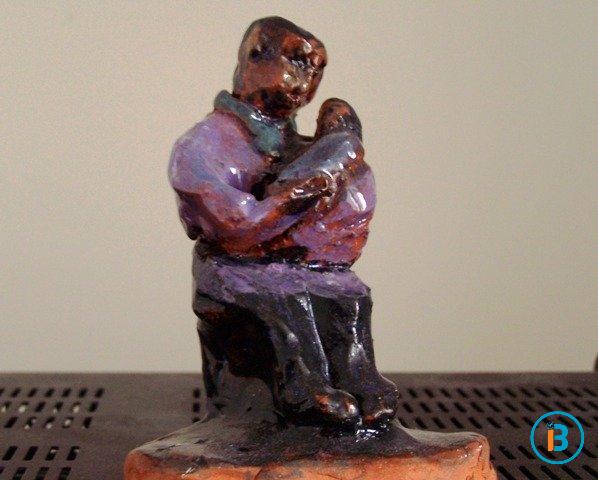 A caring mother cradles her child to sleep.