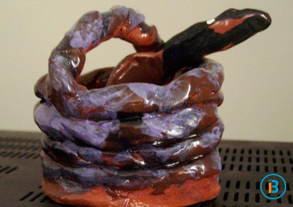 A basket with utensils in it.